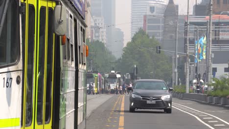 melbourne public transport travels through thick smoke as a result of the australian bushfire crisis.