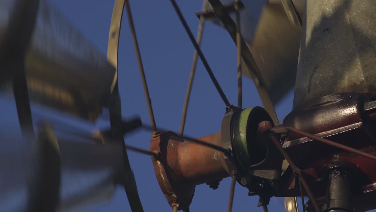 Detail of a old windmill turning with the wind on a blue sky in Patagonia, Argentina