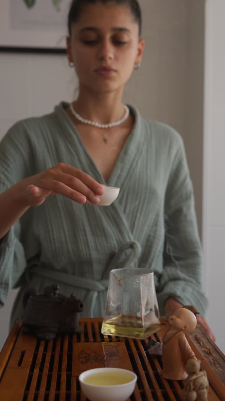 Woman performing a traditional tea ceremony