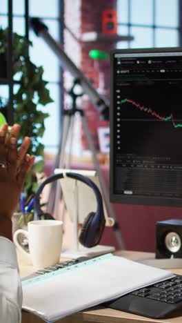 vertical video excited day trader gaining money after selling stocks