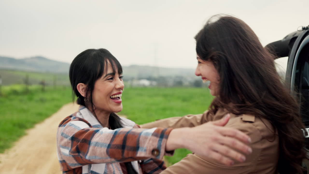 Two friends hugging on a road trip