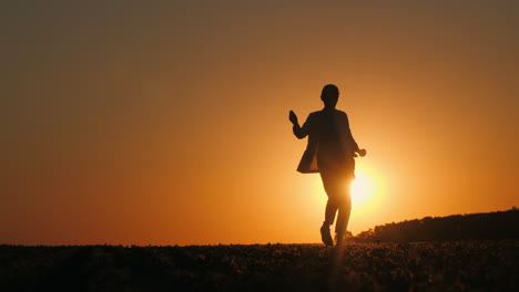 silhouette of a woman running at sunset