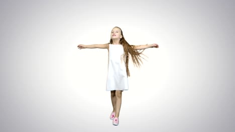 dancing little blond girl singing on white background