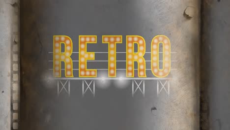 animation of retro vintage text in yellow with light bulbs on grey metallic background