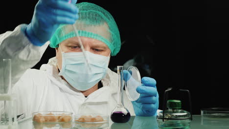 lab technician examines the meat samples in the lab