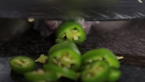 Close-up-of-cut-chillies-on-marble-top