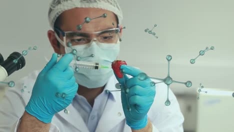 Animation-of-molecular-structures-over-asian-male-scientist-injecting-a-strawberry-at-laboratory