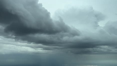 dramatic cloudset from the sky as seen by the pilots of an airplane flying across a stormy sky at 8000m high