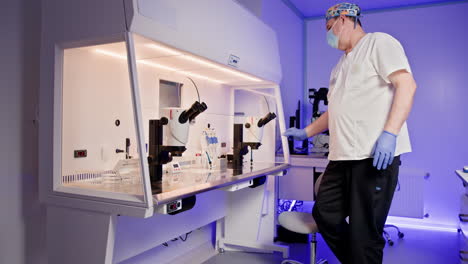 scientists working in a laboratory using microscopes