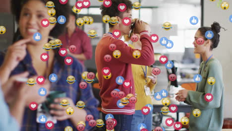 colleagues drinking coffee and chatting in open-plan office showing floating emojis for marketing