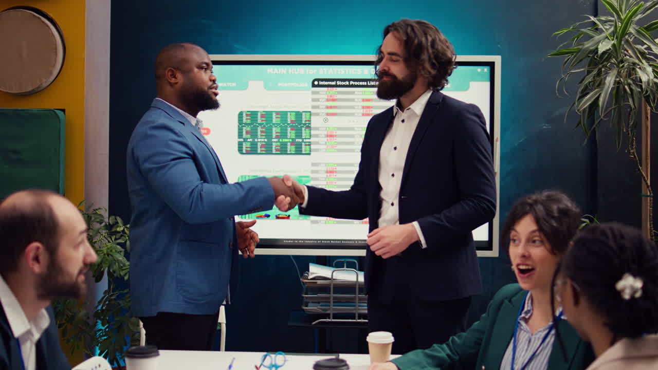 Business partners are shaking hands after establishing a new project