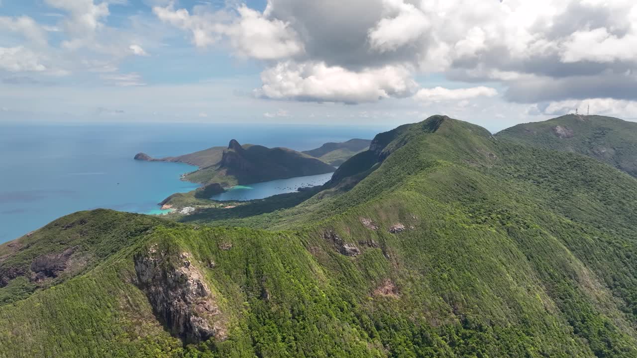 Aerial View of Lush Green Mountains and Coastline