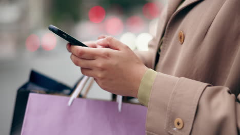 Woman,-phone-and-hands-with-shopping-bag-in-city