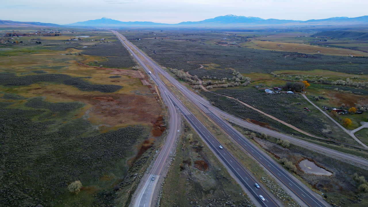 Patchwork of green leading toward mountains