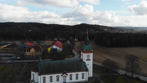 aerial - björketorps church in rävlanda, härryda, sweden, rising wide shot