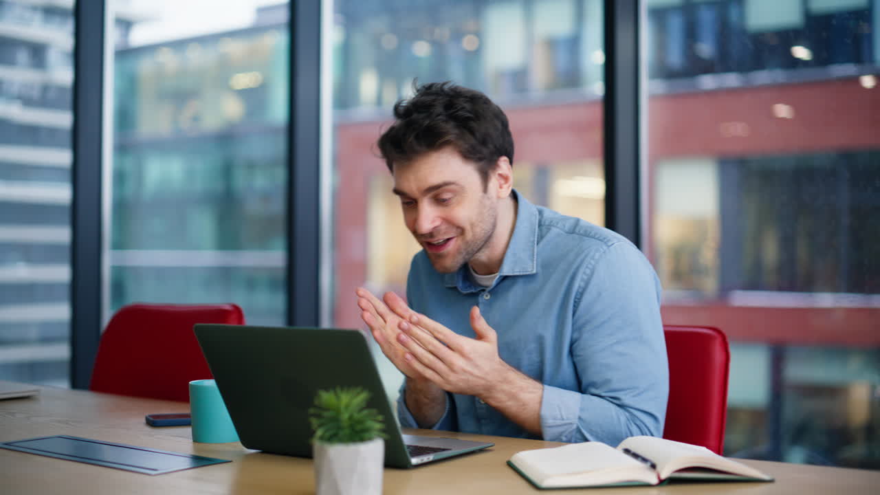 Happy winner looking laptop enjoy great news at office closeup. Overjoyed man
