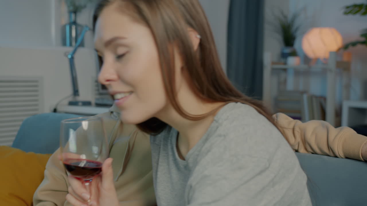 Couple enjoying wine at home