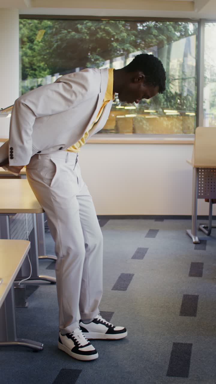 Man in Suit and Sneakers in Modern Office