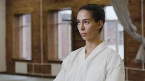 Young-woman-practising-in-a-dojo