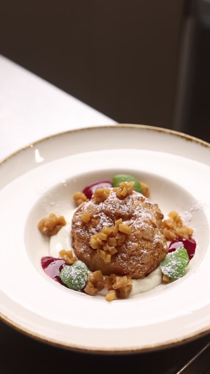 Elegant Dessert Plated with Cream, Berries, and Mint