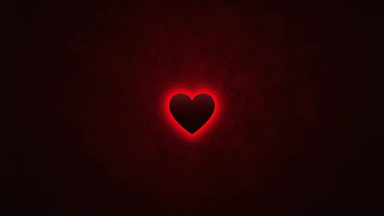 Cuore nero pulsante all'inizio dell'inquadratura, che emette un alone rosso su uno sfondo rosso scuro, simulando il respiro