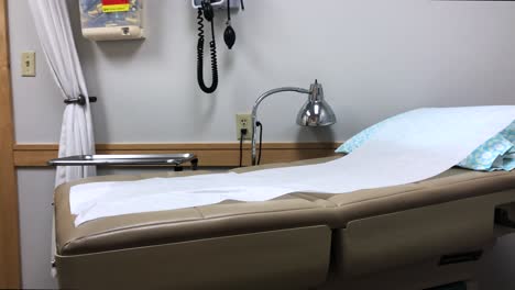 hospital bed - tools in empty doctor's office room, panning reveal