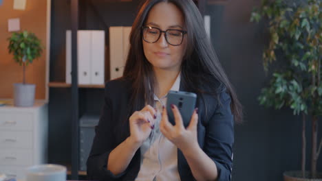 woman using smartphone in an office