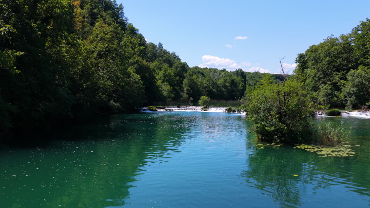 Reflections Over The Water Surface Of The Mreznica River In Croatia. Aerial Drone Shot