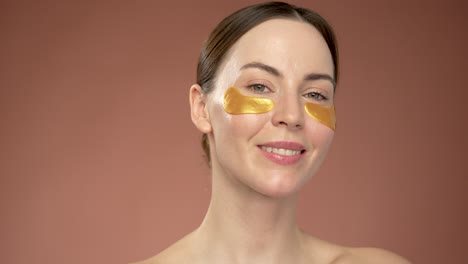 woman with gold eye patches