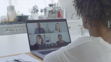 Middle-Aged-Woman-Talking-to-Other-People-On-Laptop-Video-Call-