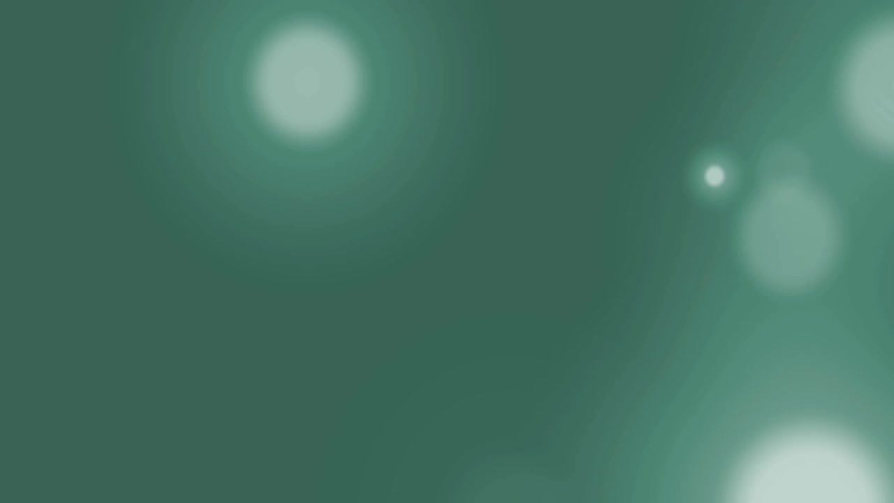 Animation of glowing light spots over green background