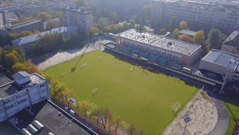 aerial view of a soccer field in an urban setting