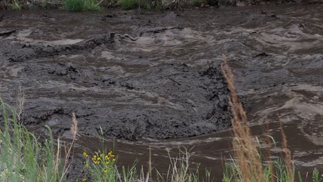 environmental catastrophe as the big thomson river runs black with mud and ash following a landslide near glen haven colorado july 15, 2022