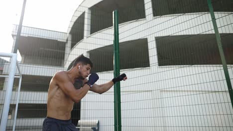 fight with shadow, boxer doing workout outdoors