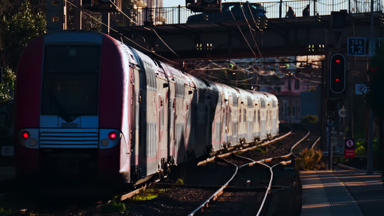 Cannes, France - January 24, 2025: Close up of a train moving on the rails near a station