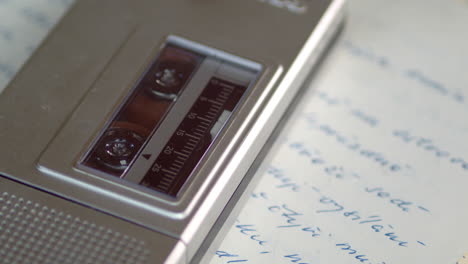 the microcassette in the recorder plays the tape slowly