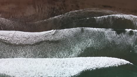 Aerial-textures-of-Piha's-black-sand-beach