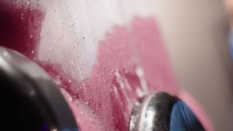 close up condensation droplets on red frozen slushie machine, 4k slow motion