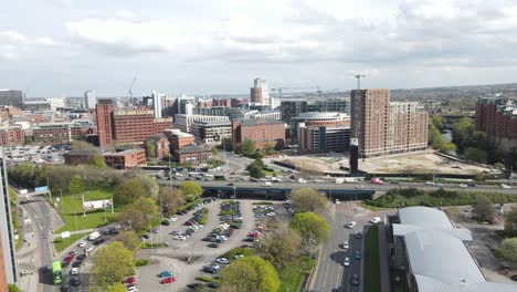 drone shot over leeds, uk, busy main road in the summertime