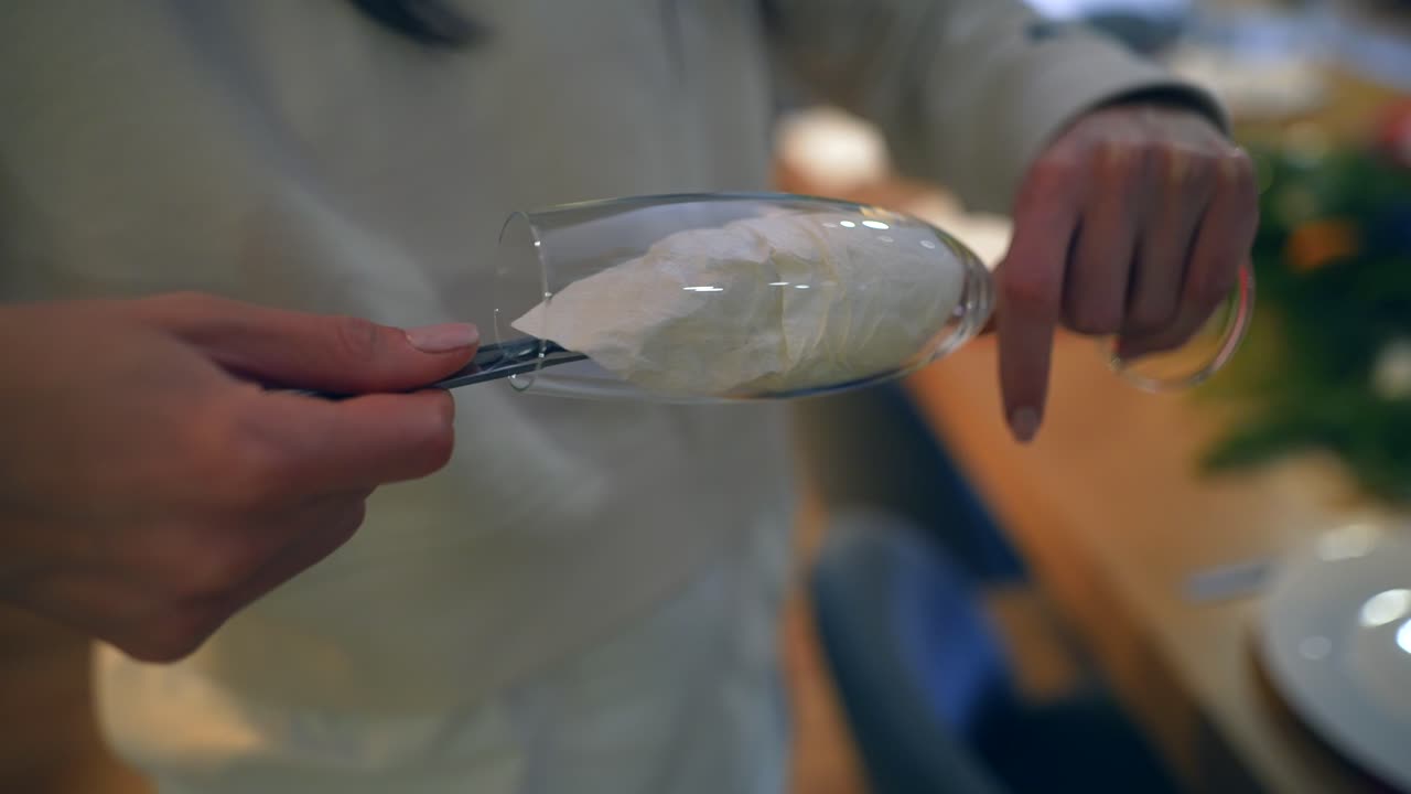 Preparing a Champagne Glass for a Dinner