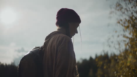 Female-explorer-wearing-knitted-hat-on-sunny-day