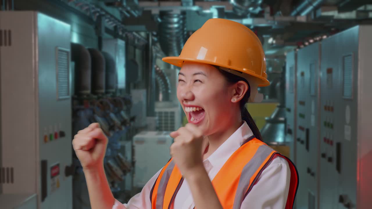 Close Up Of Side View Of Asian Female Engineer With Safety Helmet Screaming Goal Celebrating Working In Engine Control Room, Work Of Electrical Generators