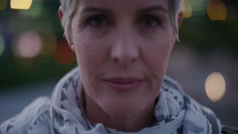 close-up-portrait-beautiful-senior-woman-looking-up-smiling-enjoying-relaxed-urban-evening-in-city-successful-retired-female-slow-motion