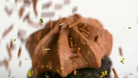 falling confetti animation, chocolate cupcake with sprinkles