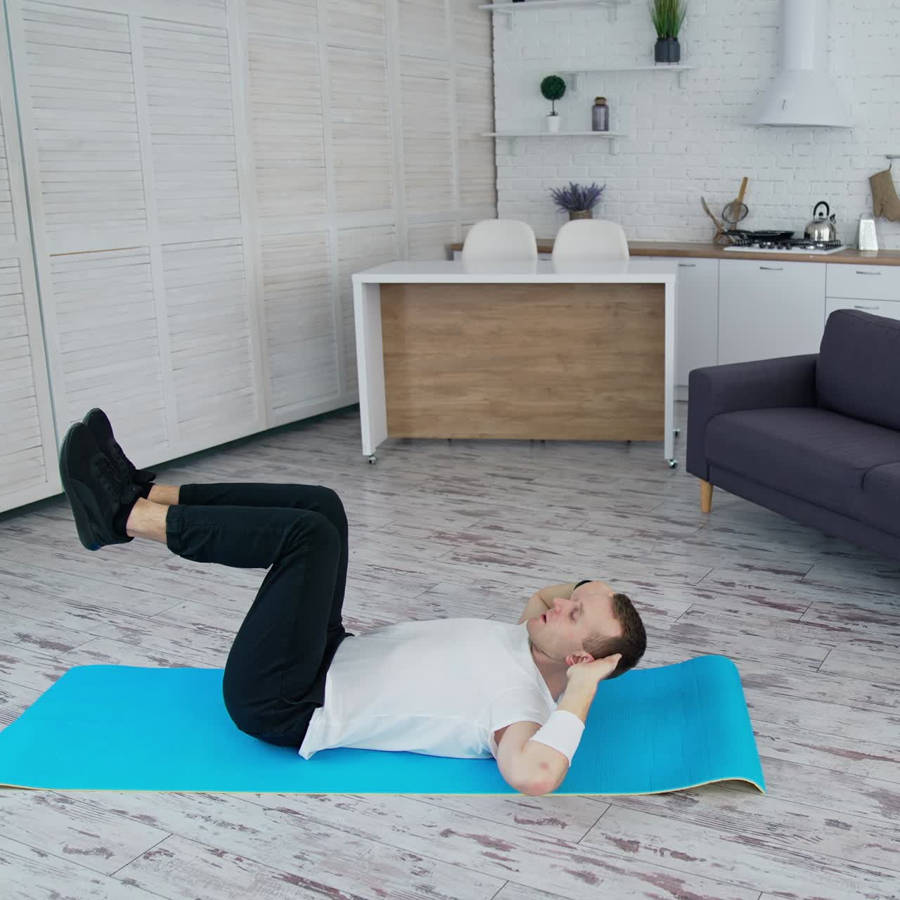 Man training indoor on lockdown time. Sporty lifestyle active man training his body