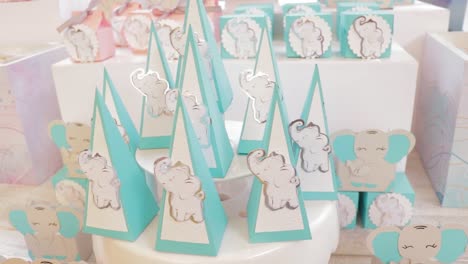 baby elephant themed candy table decorated in blue and pink colors
