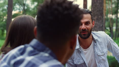 joyful friends relaxing outside. romantic couple showing tenderness party