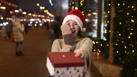 woman receiving a christmas gift at night