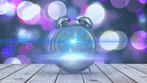 animation of new year's eve alarm clock showing midnight and flashing spotlights