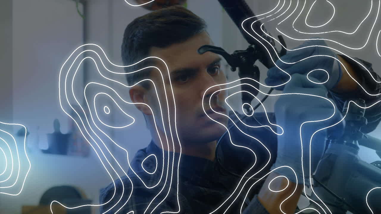 Animation of white lines over biracial man repairing bicycle